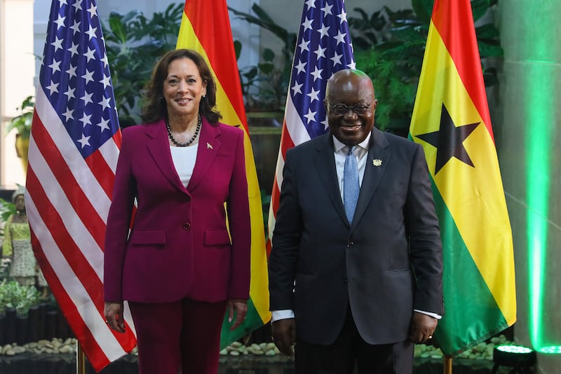 Ms Harris poses with President of Ghana Nana Akufo-Addo  as she arrives for their meeting at the Jubilee House presidential palace in Accra. AFP