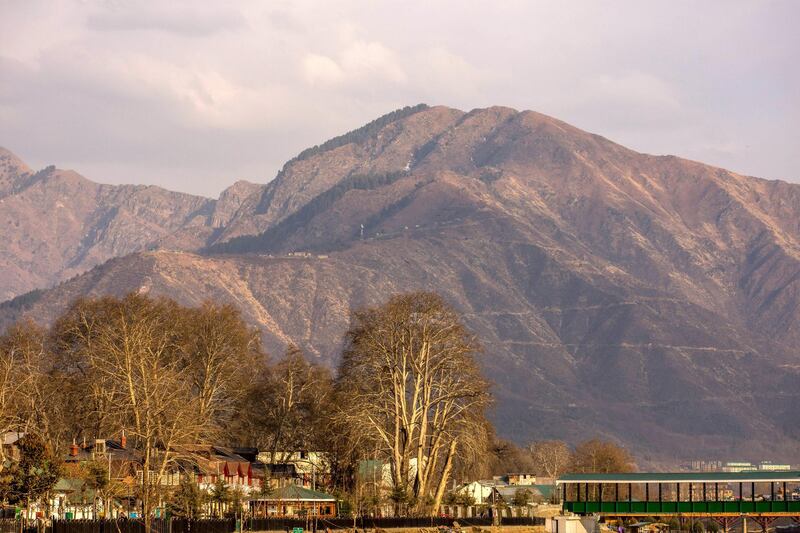 SRINAGAR, KASHMIR, INDIA - FEBRUARY 7: A view of mountains which used to be snow covered, during a warm winter day on February 7, 2018 in Srinagar, the summer capital of Indian administered Kashmir, India.The harshest 40-day period (Chilay Kalan) of the winter is almost over in Kashmir but the valley is yet to receive the season's first snowfall. Winter temperatures have increased in Kashmir and there is less snow now. Biologists believe that climate change is affecting living things worldwide, and the latest evidence suggests that warmer winters and long dry spells have decreased the water flow in rivers and streams, as there is no or less snow on the mountains.  The minimum temperatures have increased and this increase is not allowing rain to fall as snow, this has caused concern amongst those associated with agriculture and the fruit industry as the experts predict the unusual weather will impact the crop this year. (Photo by Yawar Nazir/Getty Images)