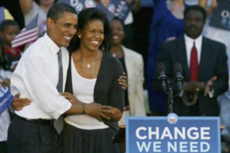 Sen.Barack Obama and his wife Michelle during a rally Tuesday.