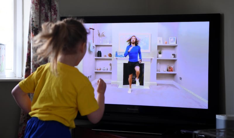 Four-year-old Lois Copley-Jones takes part in a live streamed broadcast of PE with Joe. Gareth Copley/Getty Images