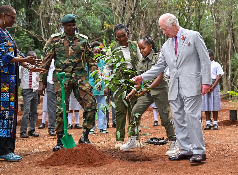 King Charles III plants a tree with environmental campaigner Karen Kimani during a visit to Karura urban forest to highlight the role of green spaces and forests in sustainable cities. Getty Images