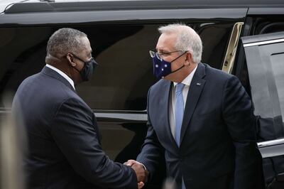 Secretary of Defense Lloyd Austin shakes hands with Australian Prime Minister as he arrives at the Pentagon on Wednesday. AFP