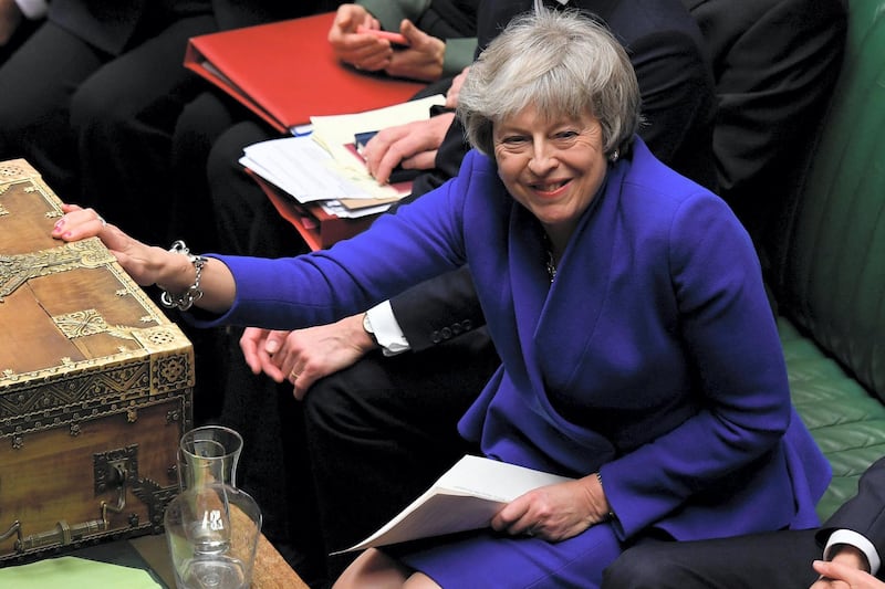 A handout photograph released by the UK Parliament's shows Britain's Prime Minister Theresa May (C) as she reacts during a debate on a no confidence motion in the House of Commons in central London on January 16, 2019. - British Prime Minister Theresa May on Wednesday narrowly survived a no-confidence vote sparked by the crushing defeat of her Brexit deal just weeks before the UK leaves the European Union. (Photo by JESSICA TAYLOR / UK PARLIAMENT / AFP) / RESTRICTED TO EDITORIAL USE - NO USE FOR ENTERTAINMENT, SATIRICAL, ADVERTISING PURPOSES - MANDATORY CREDIT " AFP PHOTO / Jessica Taylor / UK Parliament"