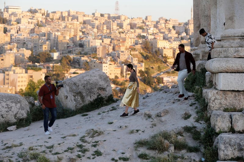 Cast members of Disney's live-action 'Aladdin' - Naomi Scott, Will Smith, Mena Massoud and Guy Ritchie -  walk during their visit to the the Amman Citadel. Reuters