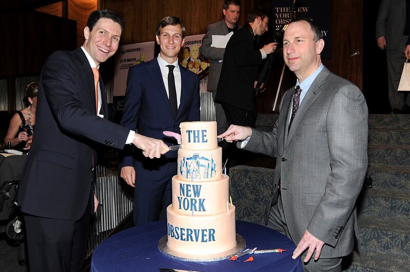 'New York Observer' editor Ken Kurson, right, with publisher Mr Kushner, centre, and chief executive Joseph Meyer, at the Observer's 25th anniversary party in March 2013.  Kursen, who received a pardon from former president Donald Trump, pleaded guilty in February 2022 to New York state cyber stalking charges that could result in the case being dropped. AP