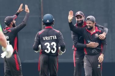 Ahmed Raza of UAE (2nd from right) during the cricket match between UAE vs Ireland at ICC academy in Dubai on 10 October, 2021. Pawan Singh/The National. Story by Paul