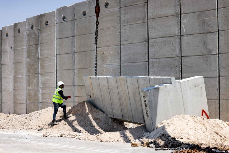 Israel is reinforcing an existing barrier in an attempt to stop Palestinians from crossing into its territory illegally.