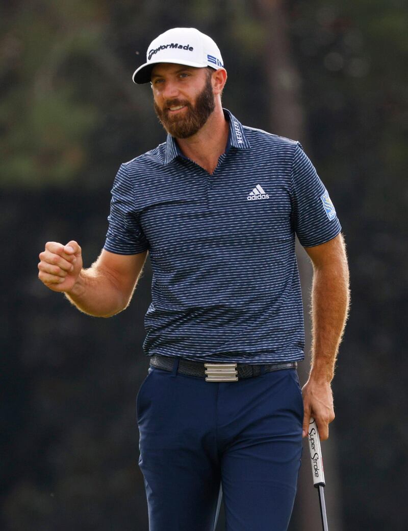 Dustin Johnson celebrates on the 18th green after winning The Masters. Reuters