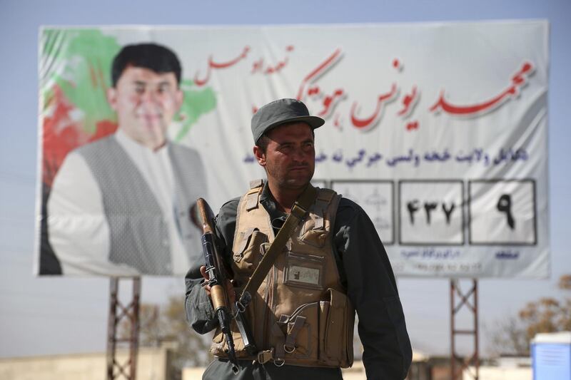 A policeman stands guard at a checkpoint at the Independent Election Commission compound in Kabul, Afghanistan. AP Photo