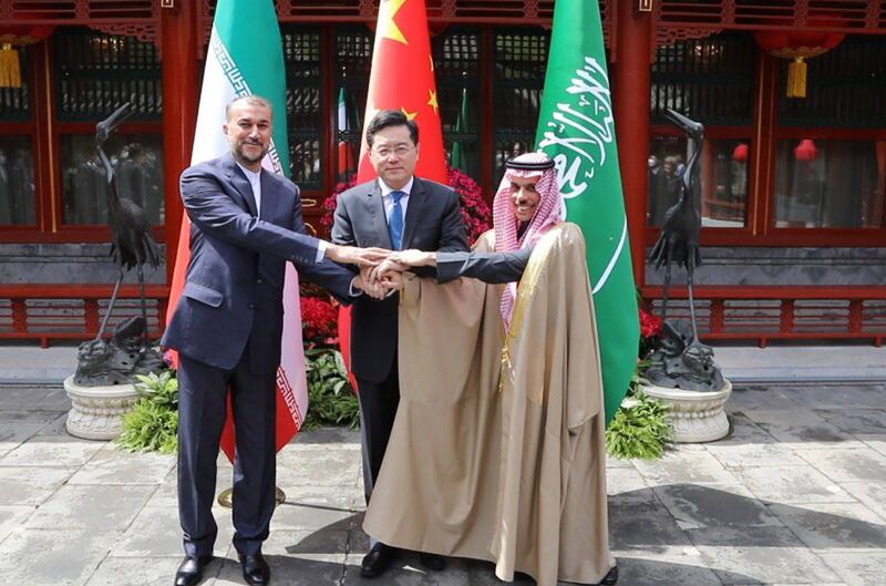 Hossein Amirabdollahian, left, Chinese Foreign Minister Qin Gang and Prince Faisal bin Farhan after their meeting in Beijing on April 6. EPA