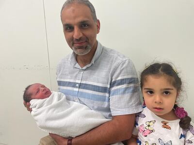 Yousuf was born at at 2.03am to an Iraqi family who arrived in the UAE only four months ago. He is pictured with his father, Dr Mustafa Alobaidi, an orthopaedic surgeon, and sister, Sama, 3. Photo: NMC Royal Hospital Sharjah