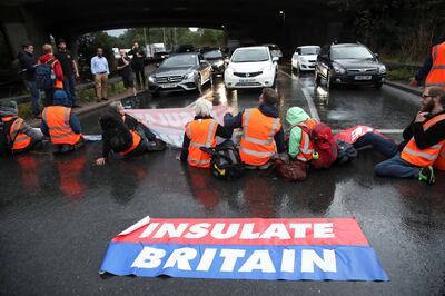 Insulate Britain activists block a motorway junction near Heathrow Airport, in London on October 1, 2021. Reuters