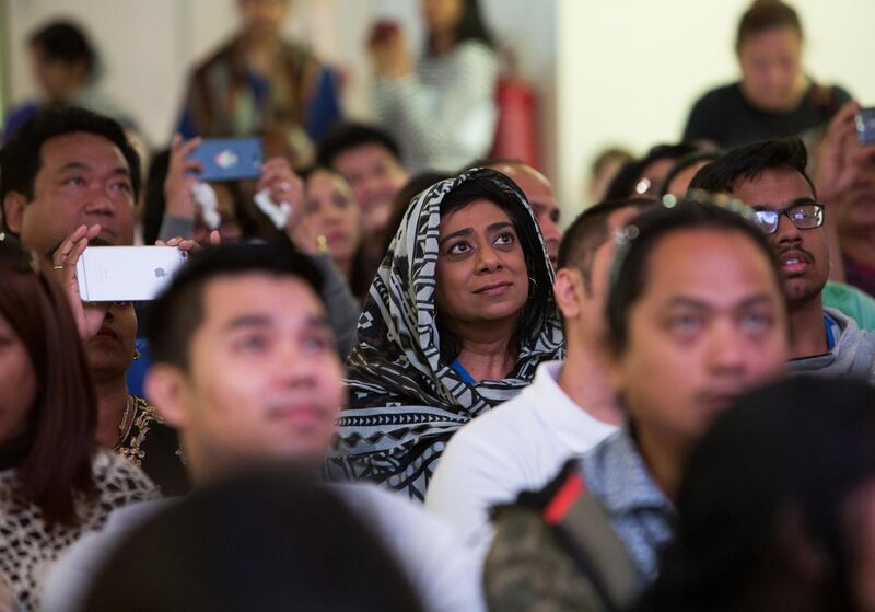 DUBAI, UNITED ARAB EMIRATES - Worshippers listening to the mass  by  Pope  Francis on the screen at St. Mary's Church, Oud Mehta.  Leslie Pableo for The National for Ramolas story