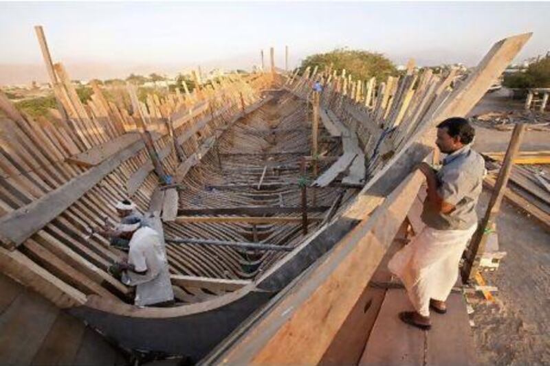 "It's a little small," Mohammed Bu Haji says of the 500-tonne boat his work crew is building in the dhow yard at Ras al Khaimah. Jaime Puebla / The National