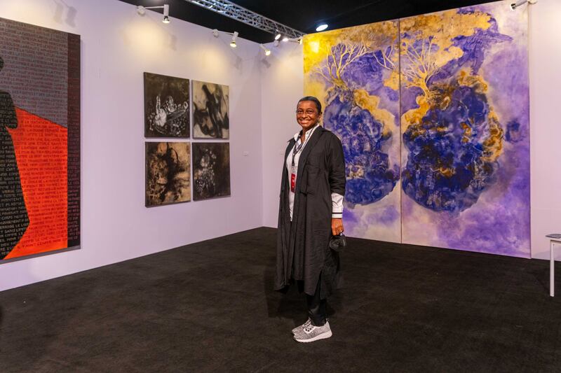 Malong Sanb, founder of Galerie MAM, poses in front of her gallery's booth at the ArtX annual art fair at the Federal Palace Hotel, Victoria Island, in Lagos, Nigeria, on November 5, 2021. AFP