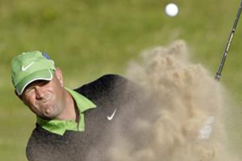 Stewart Cink splashes out of a bunker in the Open play-off.