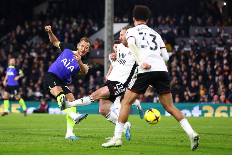 Harry Kane of Tottenham Hotspur has a shot whilst under pressure from Tim Ream of Fulham. Getty Images