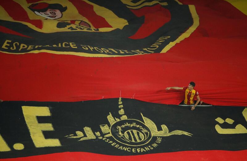 General view of a Esperance Sportive de Tunis fan between two banners before the match. Reuters