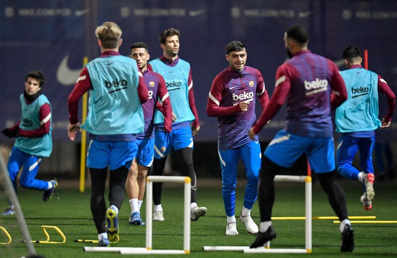 Barcelona's Spanish midfielder Pedri and teammates take part in a training session. AFP