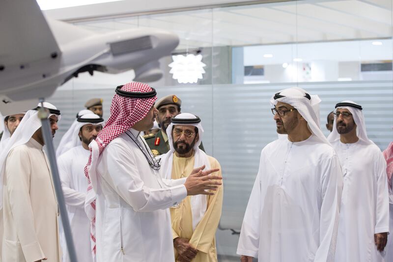 Sheikh Mohammed tours the exhibition with Sheikh Tahnoon bin Zayed Al Nahyan Deputy National Security Advisor and Chairman of the Presidential Aviation Authority (3rd R). Ryan Carter / Crown Prince Court - Abu Dhabi