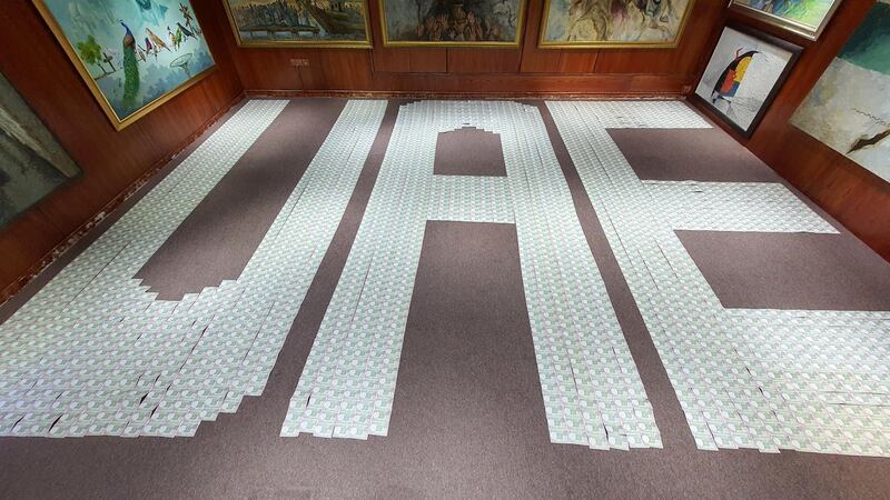 The world's largest banknote word, made using 3,040 one-rupee banknotes of India. Photo courtesy: Ramkumar Sarangapani