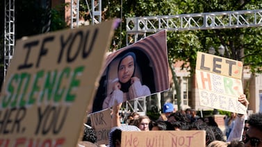 Students hold up a photo of University of Southern California valedictorian Asna Tabassum during a protest against her cancelled commencement speech. AP