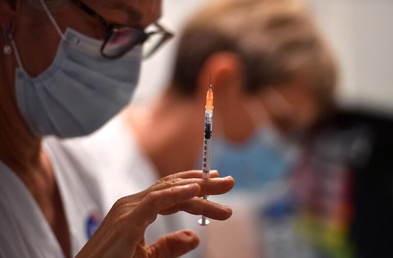 A nurse fills a syringe with the Pfizer-BioNtech vaccine in Montpellier in the south of France. AFP