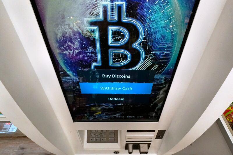 A Bitcoin logo on the display screen of a cryptocurrency ATM in Salem, New Hampshire. AP