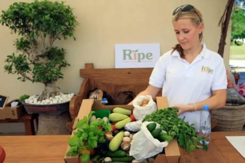 ABU DHABI - 18NOV2011 - Becky Balderstone, Ripe Manager selling organic mix vegetables at farmers market at Khalifa Park yesterday in Abu Dhabi. Ravindranath K / The National