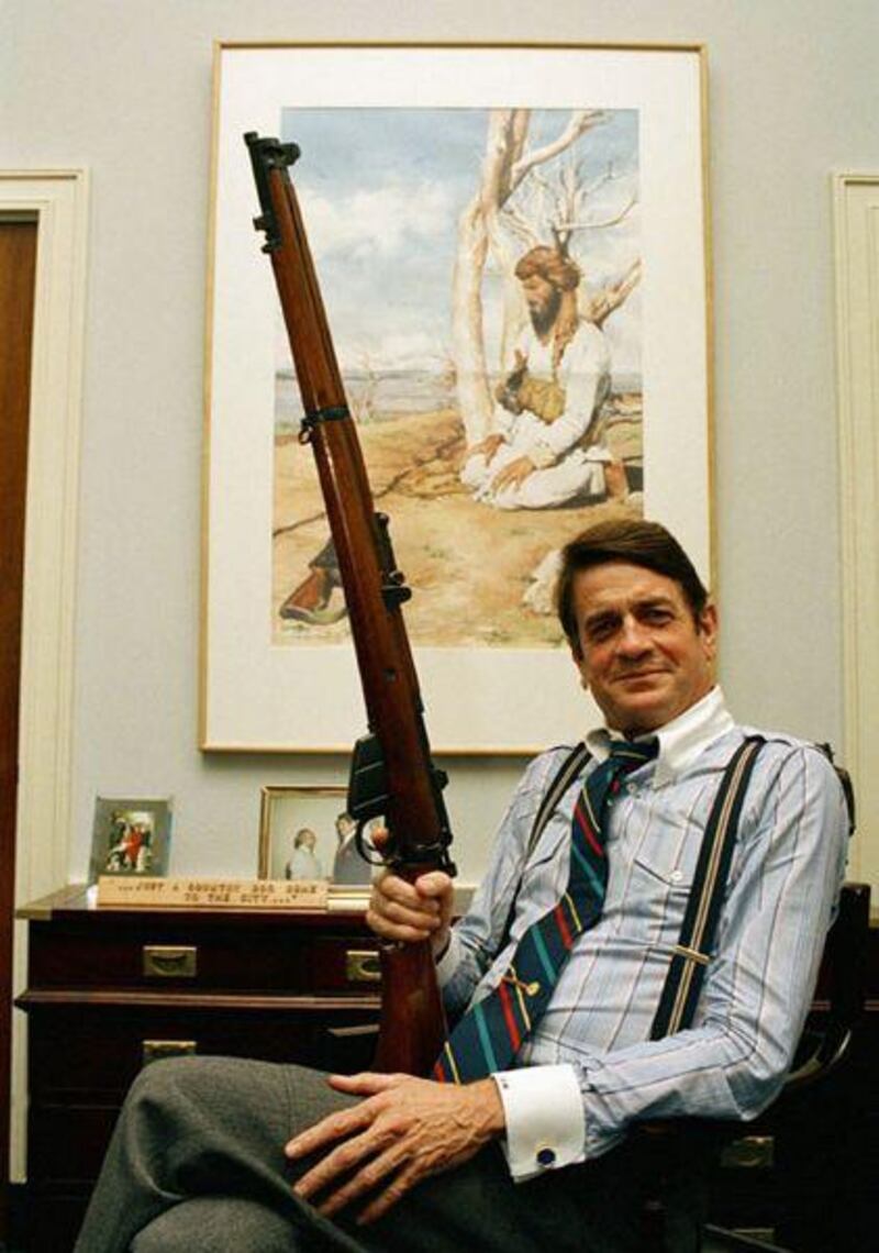 Rep Charlie Wilson holds a British Enfield rifle in his Capitol Hill office in Washington in 1988.