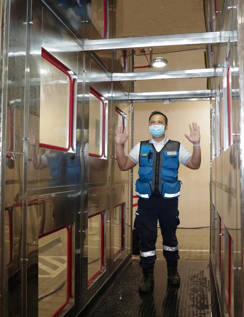 A paramedic walks through the self sterilisation corridor in Dubai. Courtesy - Dubai Media Office