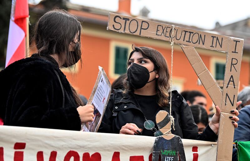 Iranians protest outside the country's embassy in Rome after the execution of Mohsen Shekari. EPA