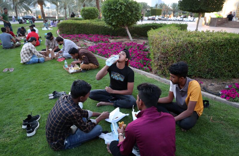 Worshippers break their fast at the Al Majaz waterfront in Sharjah. Pawan Singh / The National