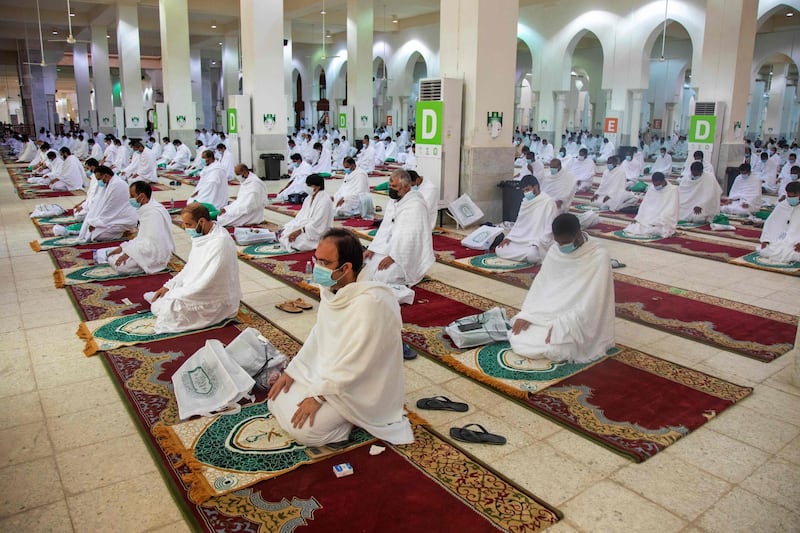 Muslim pilgrims attending prayers. AFP