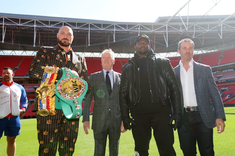 From left, Tyson Fury, promoter Frank Warren, Dillian Whyte and Todd DuBoef, president of Top Rank Boxing, at the Wembley Stadium. Getty