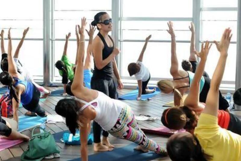 Fran Diaz teaches Yoga at the Top in the Burj Khalifa. Courtesy Fitness First
