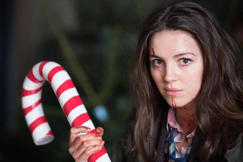 Ella Hunt (Anna) in the Christmas Tree Emporium with her candy cane as a weapon. Courtesy Front Row Filmed Entertainment