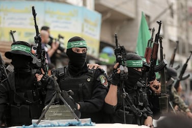 Members of the Islamist movement Hamas' military wing Al Qassam Brigades ride in vehicles in Deir Al Balah in the central Gaza strip on May 6, 2018. AFP
