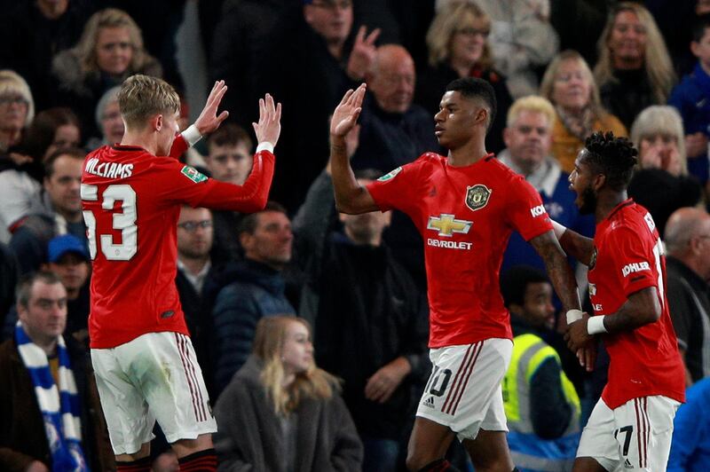 Manchester United's Marcus Rashford, centre, celebrates after scoring the opening goal. AP