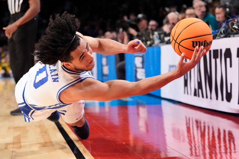 Duke guard Jared McCain dives for the ball during the second half of the team's first-round college basketball game against Vermont in the men's NCAA Tournament in New York. AP