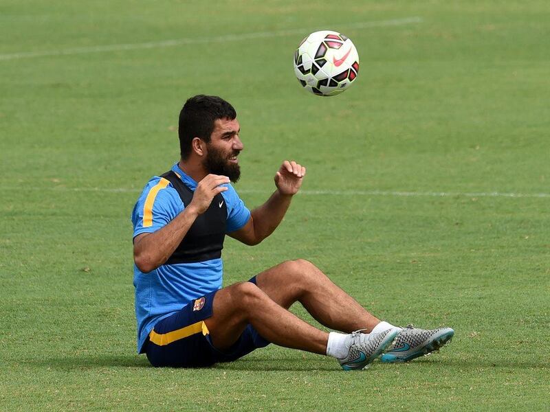 New Barcelona signing Arda Turan heads the ball during a training session at the StubHub Center, home of the LA Galaxy, on Monday. Mark Ralston / AFP