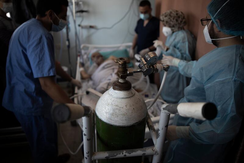 A Palestinian Covid-19 patient receives oxygen in the intensive care unit of the Gaza European Hospital in the Gaza Strip. AP Photo