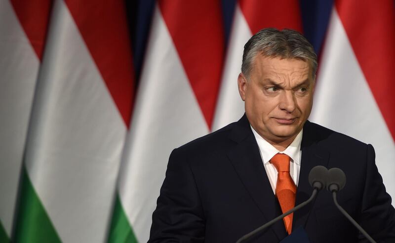 (FILES) This file photo taken on February 18, 2018 shows Hungarian Prime Minister and Chairman of FIDESZ party Viktor Orban delivering his state of the nation speech in front of his party members and sympathizers at Varkert Bazar cultural center in Budapest.
A week ago Hungary's right-wing Prime Minister Viktor Orban, campaigning against immigration and George Soros and boosted by a booming economy, looked a shoo-in for another commanding election victory on April 8. / AFP PHOTO / Attila KISBENEDEK