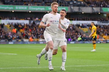WOLVERHAMPTON, ENGLAND - MAY 11: Kevin De Bruyne of Manchester City celebrates after scoring their side's first goal with Phil Foden during the Premier League match between Wolverhampton Wanderers and Manchester City at Molineux on May 11, 2022 in Wolverhampton, England. (Photo by Catherine Ivill / Getty Images)