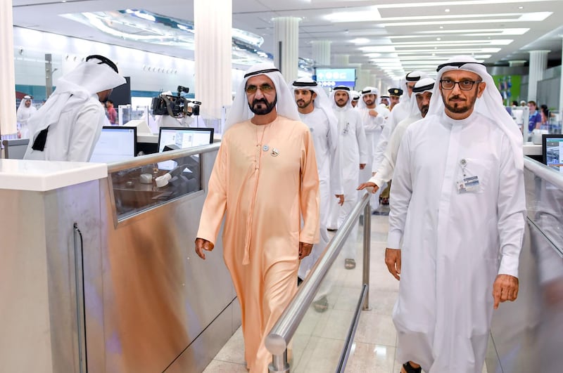 <p>Sheikh Mohammed leads his delegation through passport control. Wam</p>
