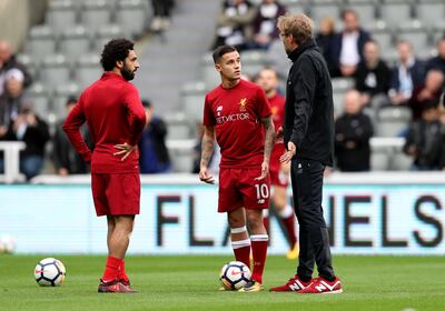 Soccer Football - Premier League - Newcastle United vs Liverpool - St James��� Park, Newcastle, Britain - October 1, 2017   Liverpool manager Juergen Klopp talks to Philippe Coutinho and Mohamed Salah during the warm up before the match    REUTERS/Scott Heppell  EDITORIAL USE ONLY. No use with unauthorized audio, video, data, fixture lists, club/league logos or "live" services. Online in-match use limited to 75 images, no video emulation. No use in betting, games or single club/league/player publications. Please contact your account representative for further details. - RC167A80D160