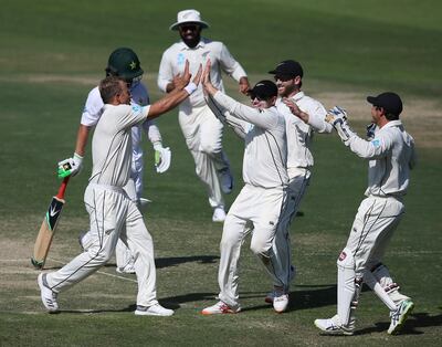 New Zealand's Neil Wagner and team mates celebrate the dismissal of Pakistan's player in their test match in Abu Dhabi, United Arab Emirates, Monday, Nov. 19, 2018. (AP Photo/Kamran Jebreili)