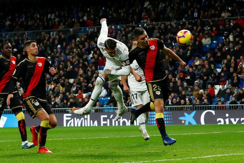 Real Madrid defender Sergio Ramos heads at goal. Reuters