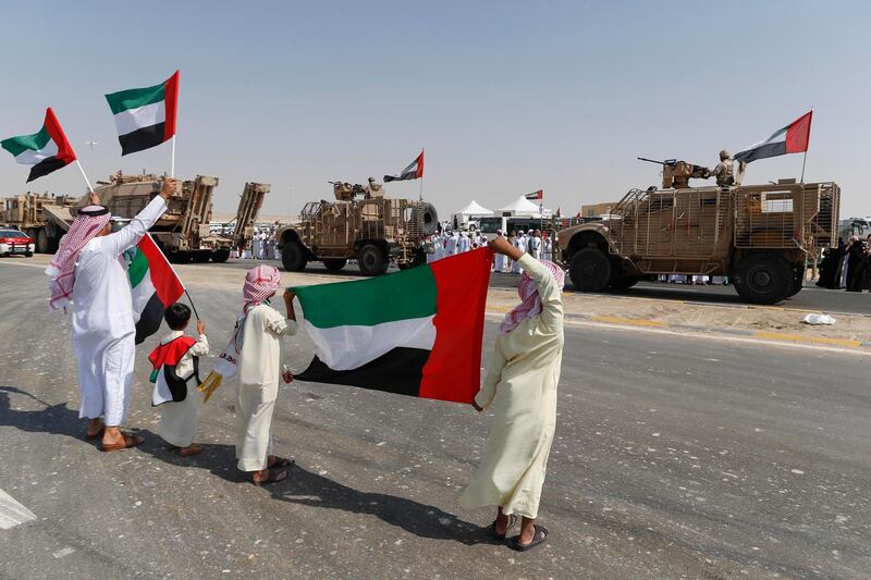 ABU DHABI, UNITED ARAB EMIRATES, 07 NOVEMBER 2015. Emirati Nationals celebrate the first return of soldiers from their campaign in Yemen at the entrance to Zayed Military City on the Sweihan road. (Photo: Antonie Robertson/The National) Journalist: Nasser Al Remeithi. Section: National. *** Local Caption ***  AR_0711_Soldiers_Return-07.JPG