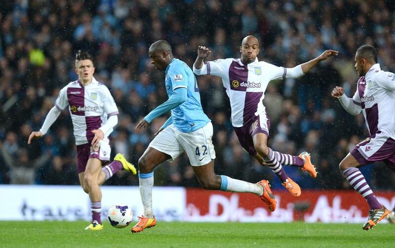 Manchester City midfielder Yaya Toure runs clear to score his team's fourth goal during their Premier League victory over Aston Villa on Wednesday. Andrew Yates / AFP / May 7, 2014